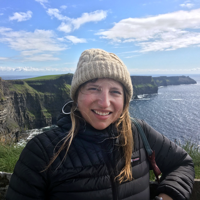 Portrait of Haley Poole with the beach and cliffs in the background